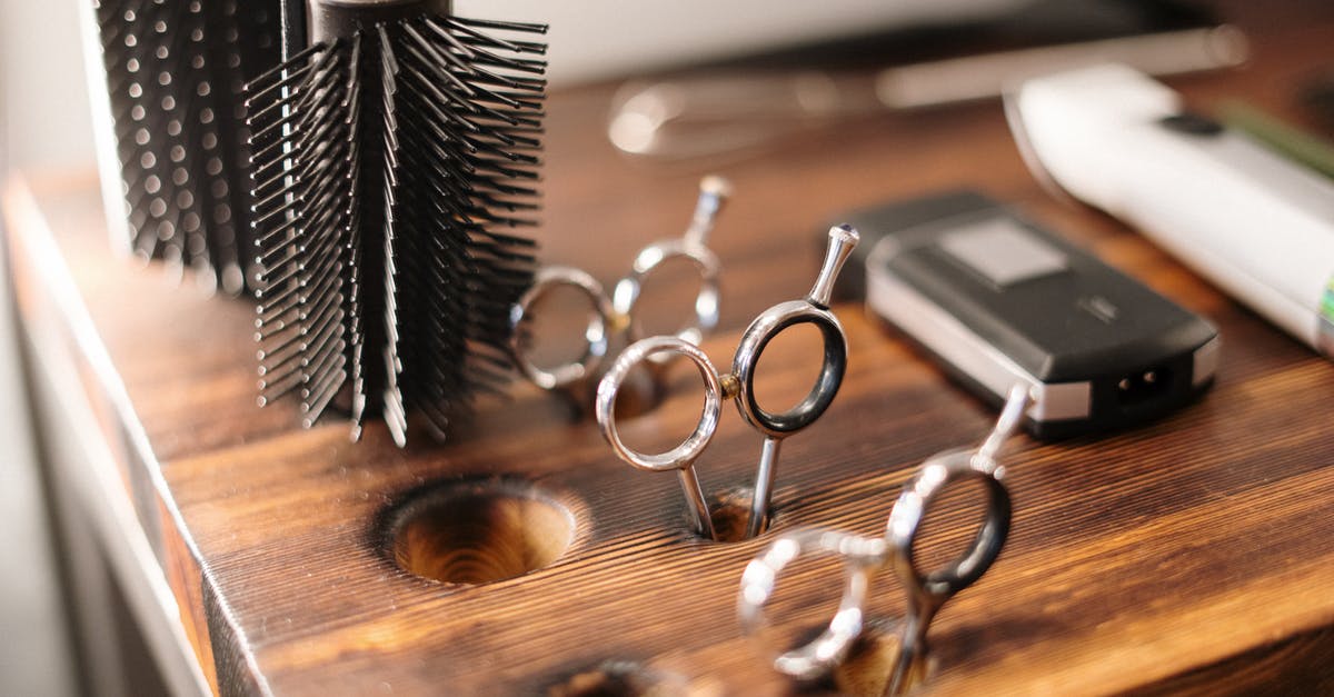 Which tools can be used to safely cut bone? - Black and Silver Skeleton Key on Brown Wooden Table