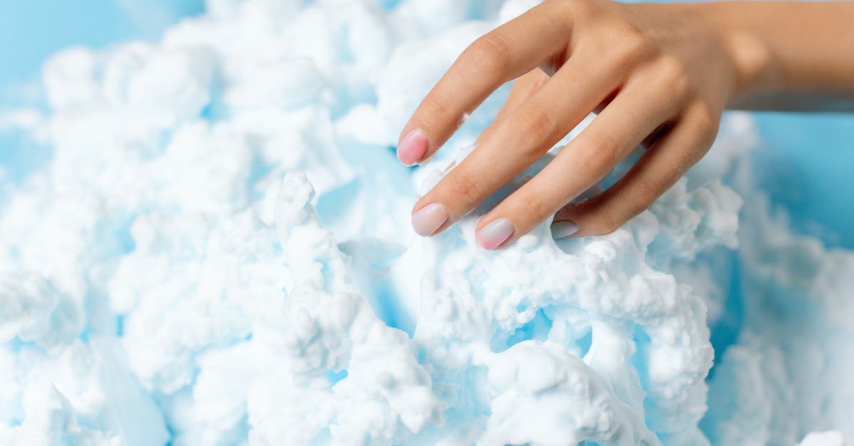 White cloud of foam while fermenting tepache - Hand Holding White Foam