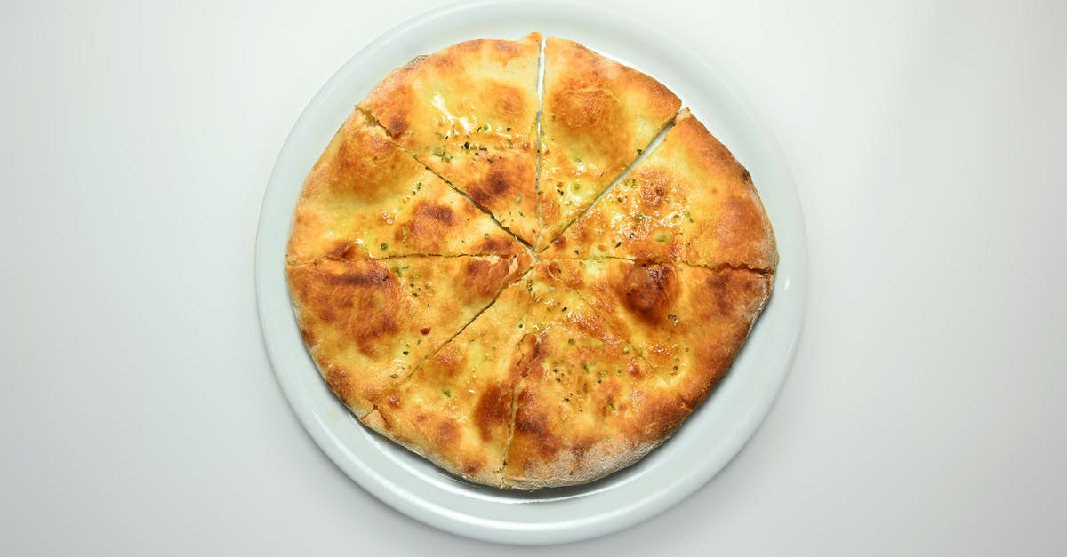 White dots on pizza or focaccia after baking - Pizza bread food isolated background