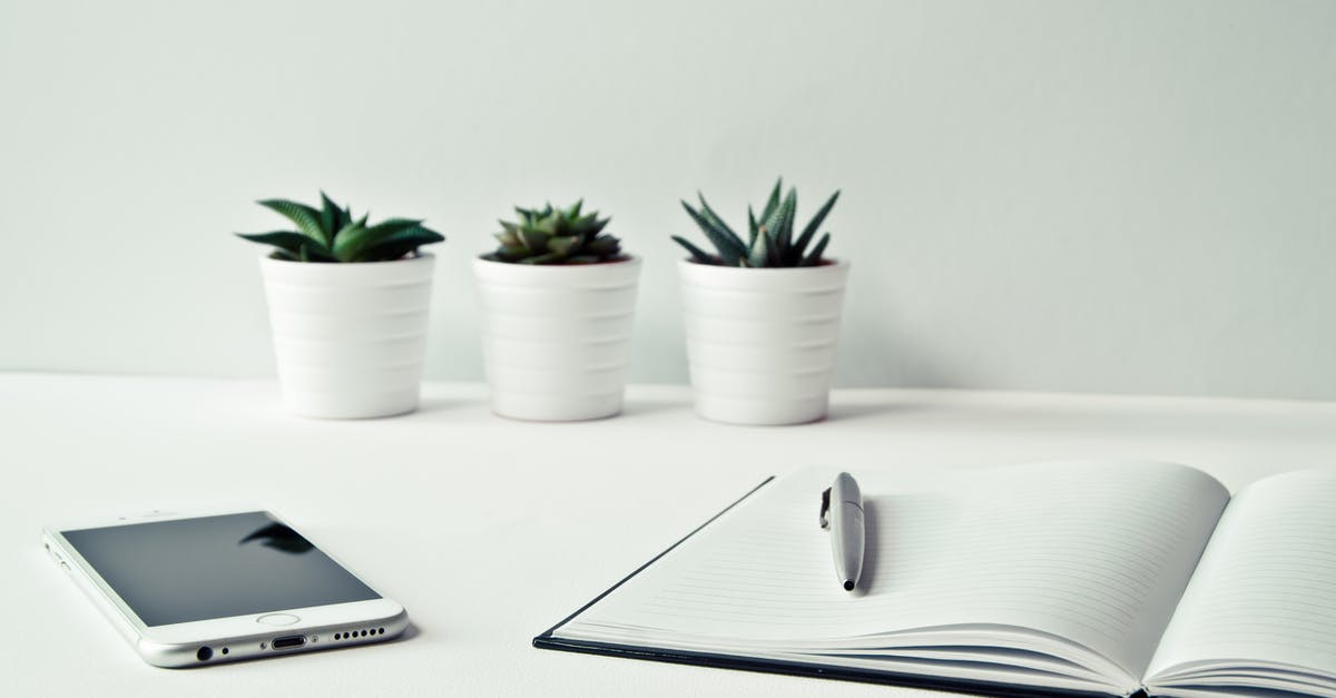 White efflorescence on home-dried prunes - Three White Ceramic Pots With Green Leaf Plants Near Open Notebook With Click Pen on Top