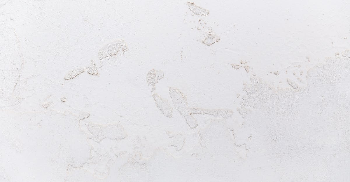 White texture on natto - White shabby concrete wall with cracked stucco