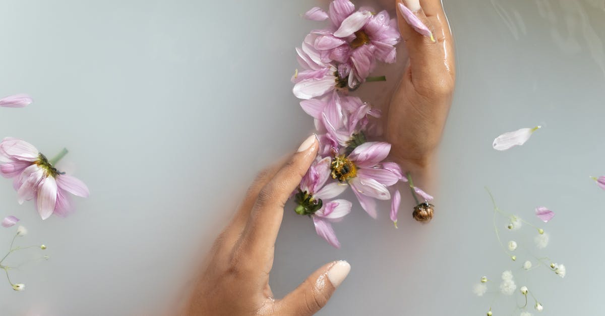 Who would I take my knives to, to be conditioned? - Woman holding flowers in hands in water