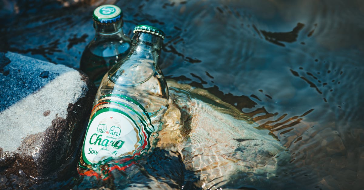 Why add soda water to beer batter? - Soda Bottles on Rocks in Water