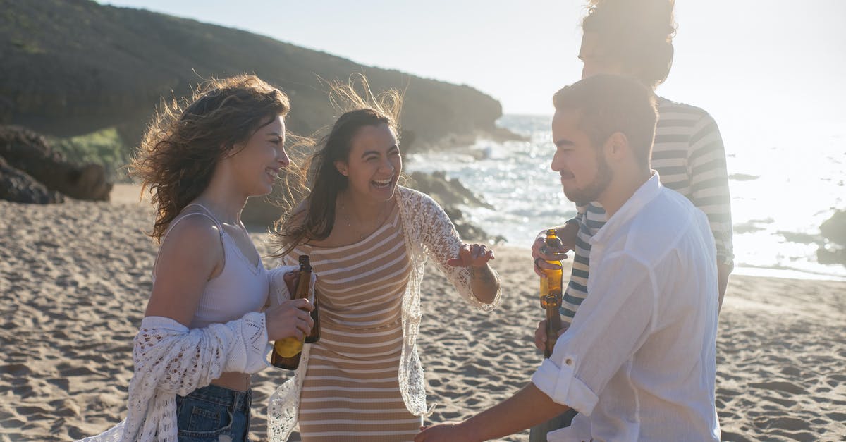 Why add soda water to beer batter? - People Standing on Beach Sand while Drinking Beer