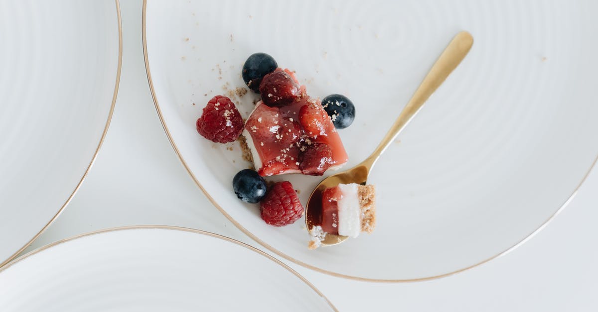 Why are jelly donuts usually raspberry flavored - Cheesecake with Jelly on Top and Fresh Raspberries and Blueberries