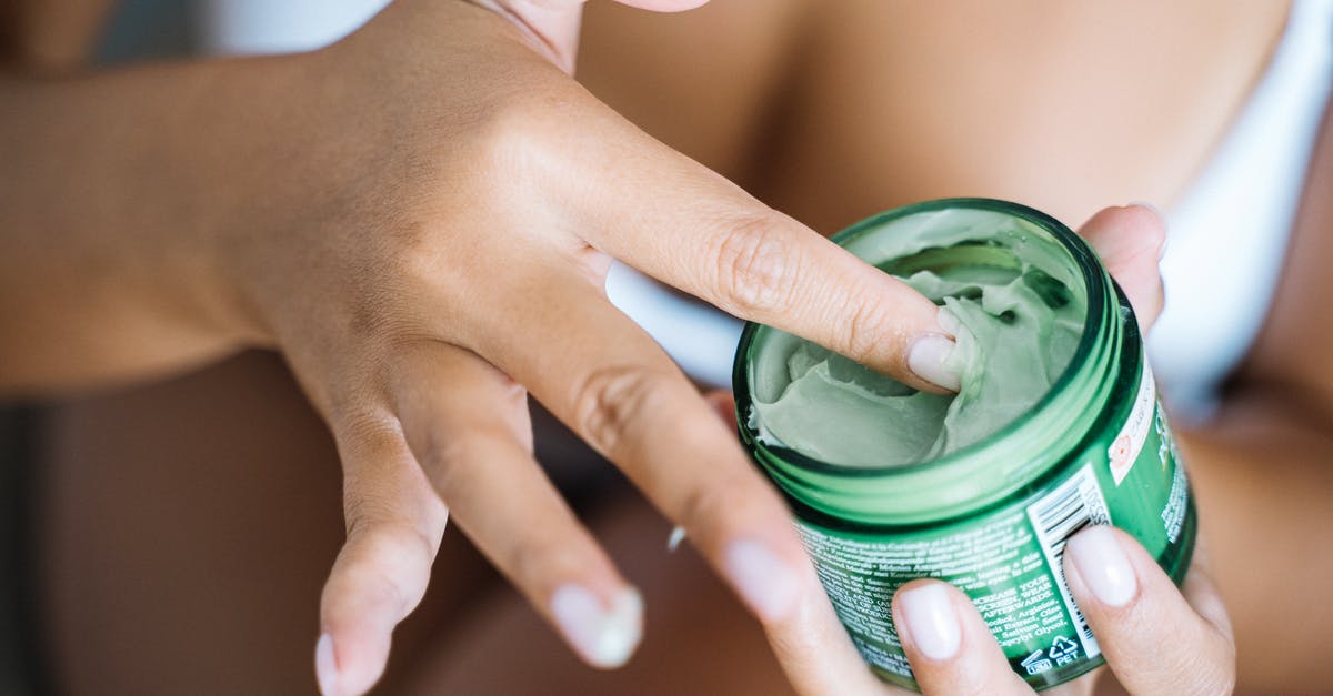 Why are our olives getting moldy? - Person Holding Green and White Plastic Cup