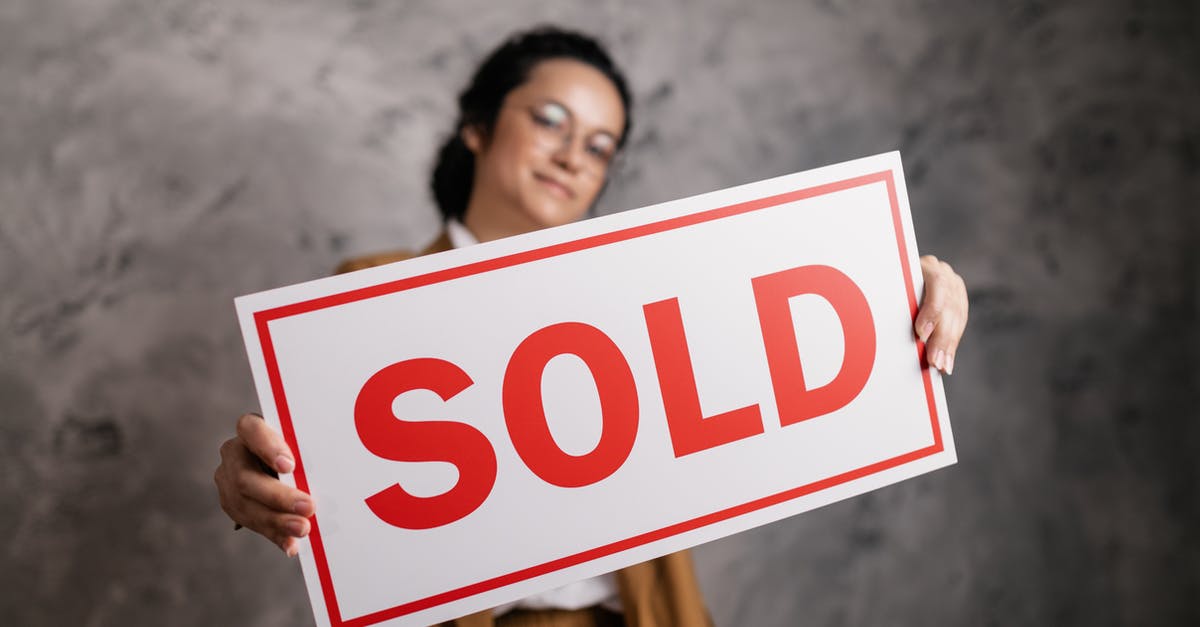 Why are parsnips sold pre-clipped? - Woman Holding a Signboard 