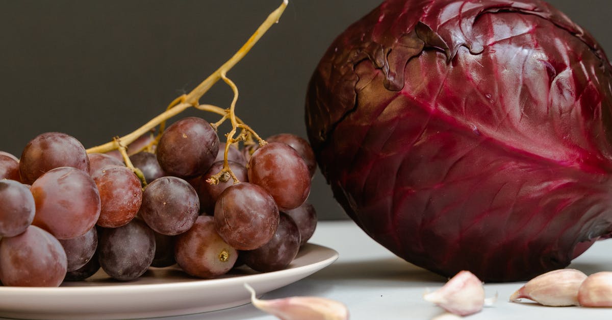 Why are predominantly grapes an ingredient in wine? - Red Cabbage and Grapes on a White Surface