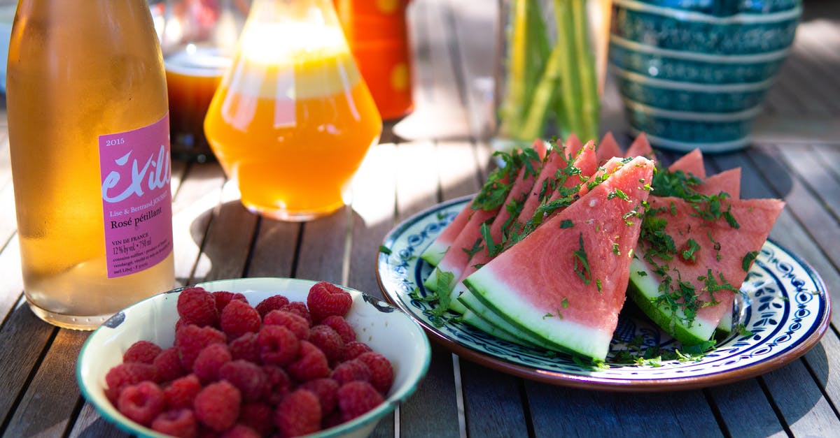 Why are red wine glasses wider than white wine glasses? - Sliced Watermelons on White Plate