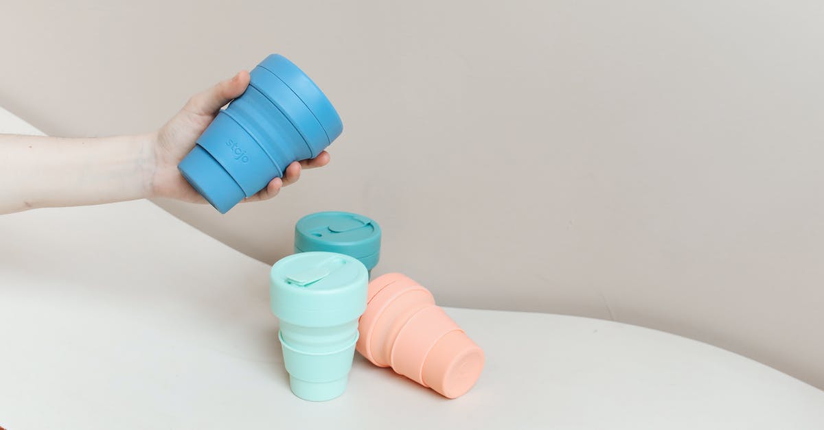 Why are there no PETE reusable cups? [closed] - Close-Up Shot of a Person Holding a Collapsible Cup