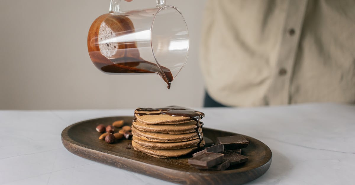 Why arent my pancakes browning correctly? - Person Pouring Chocolate Syrup on Brown Pancake