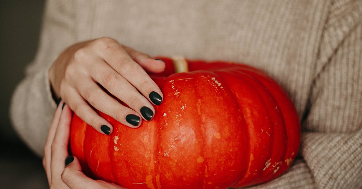 Why did butternut squash make my fingers dry and yellow? - Photo of Woman Holding A Pumpkin