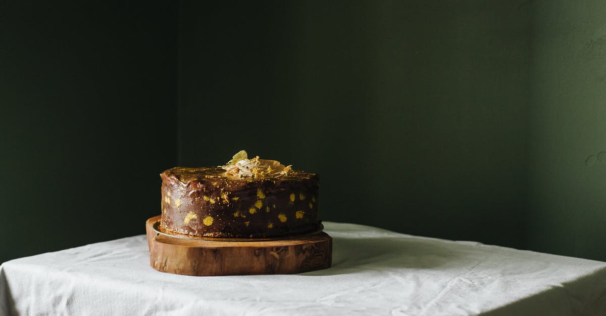 Why did my chocolate icing exude its cocoa butter? - Delicious cake with topping on wooden board