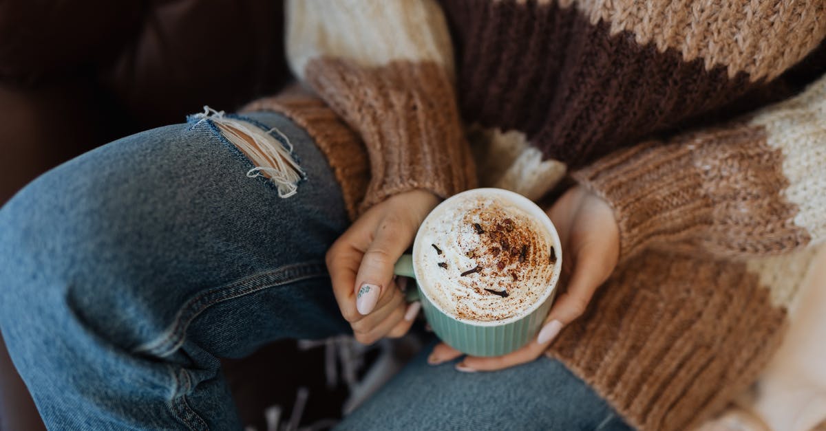 Why did my chocolate tempering fail? - Person Holding White Ceramic Mug With Coffee