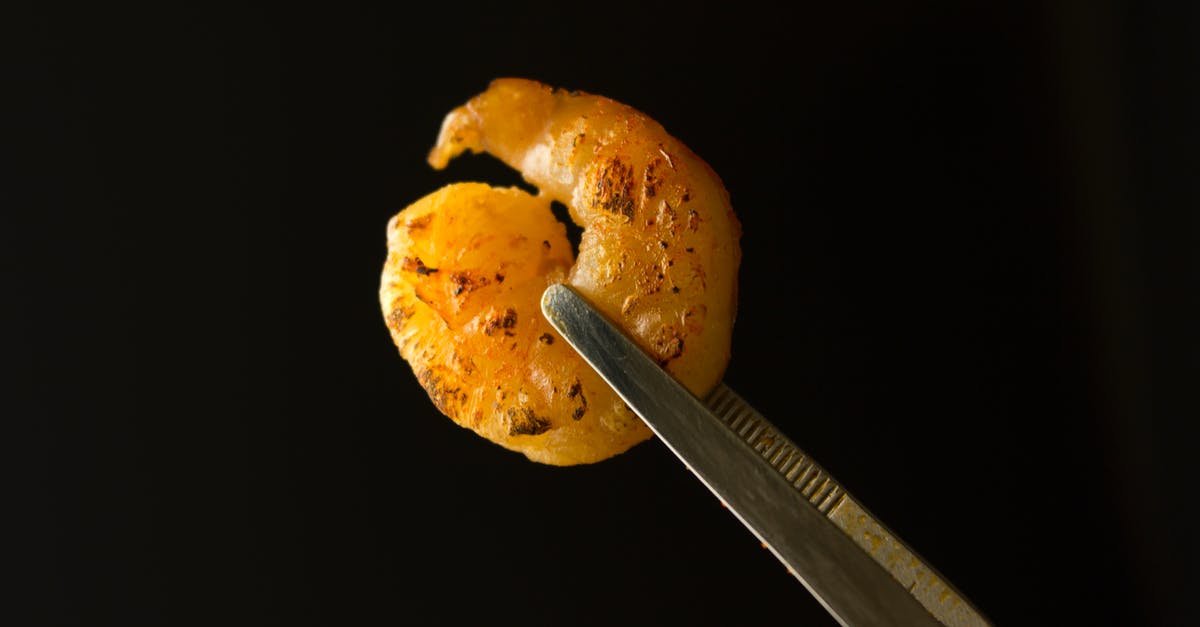 Why did my shrimp bisque turn out so broth like? - Breaded Shrimp on Black Background