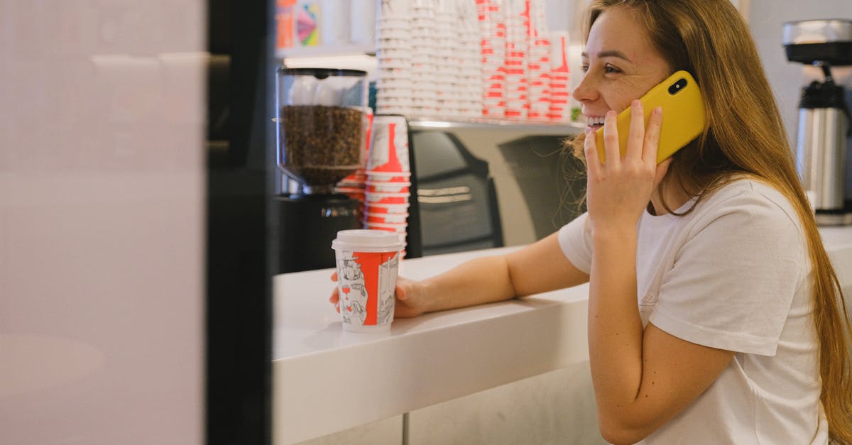 Why didn't my brioche rise? - Woman in White Crew Neck Shirt Holding a Cellphone and Disposable Cup