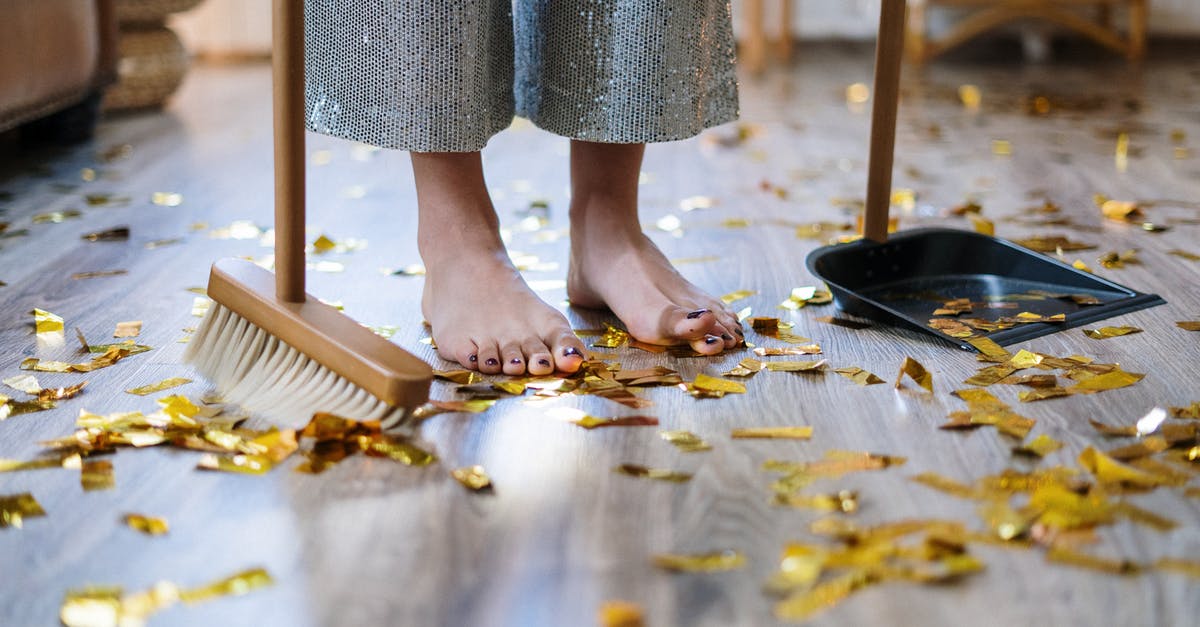 Why do chefs insist that cleanliness is next to godliness? - Woman in Gray Dress Standing on Brown Wooden Floor