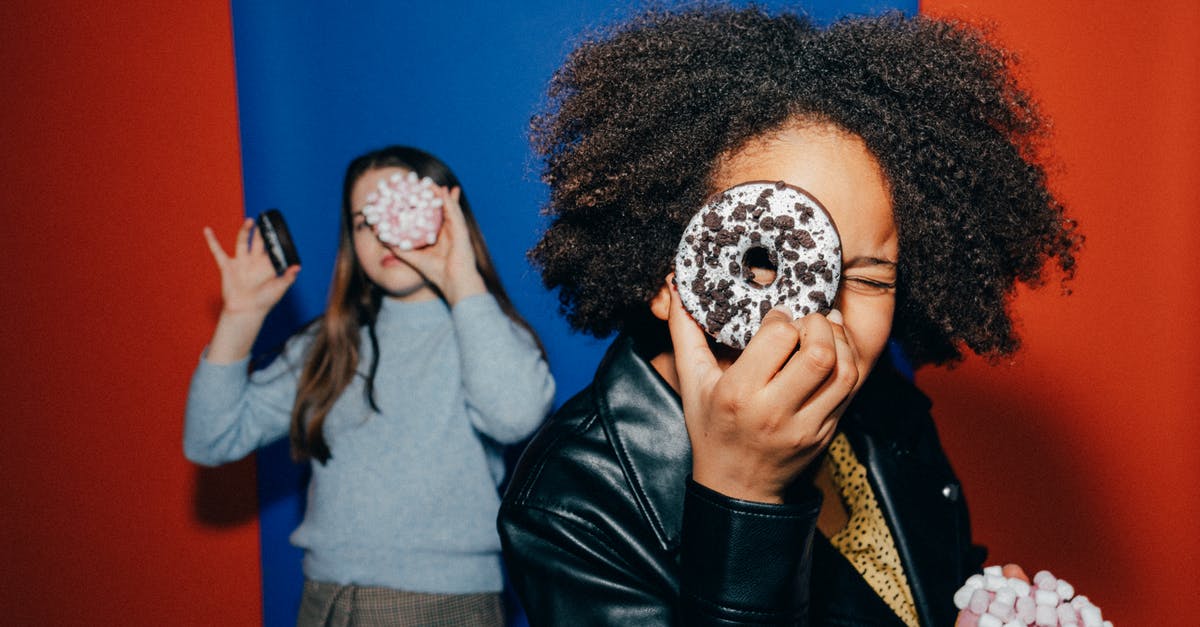 Why do doughnuts have holes? - Girls Holding Doughnuts