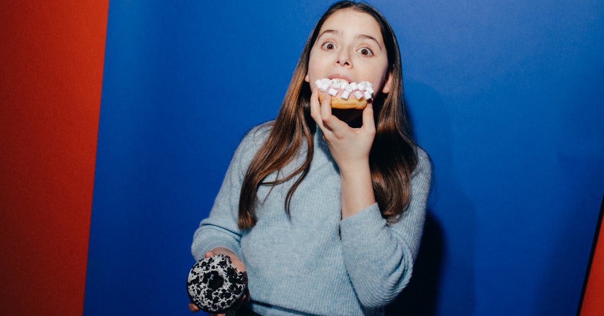 Why do doughnuts have holes? - Girl Eating a Doughnut