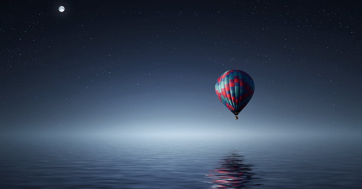 Why do dumplings float when they are ready? - Red and Blue Hot Air Balloon Floating on Air on Body of Water during Night Time