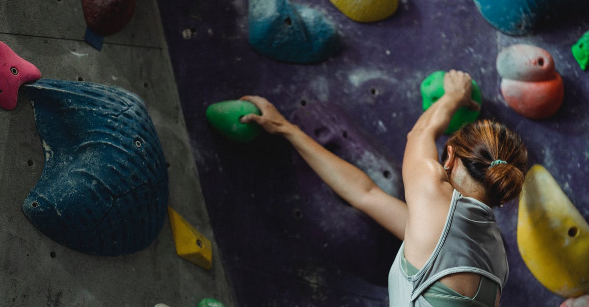 Why do my caramels turn out hard in the center? - Faceless muscular sweaty female climber climbing high on wall during bouldering training in sports center