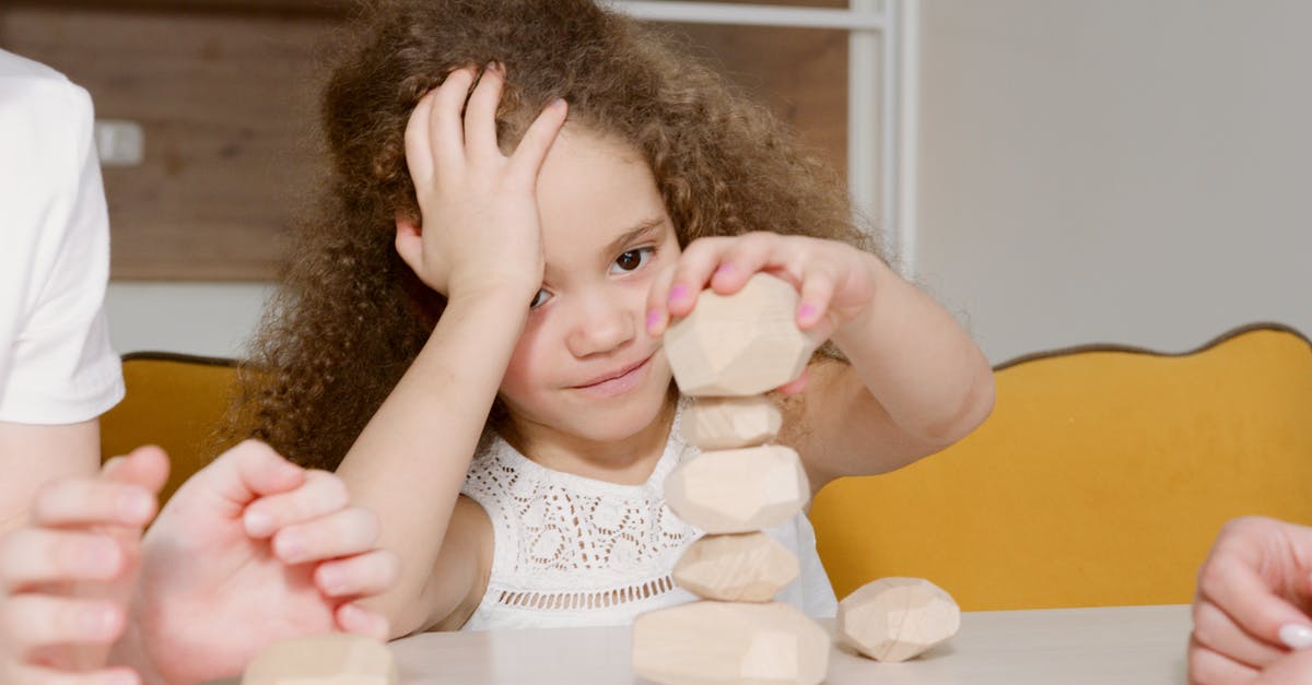 Why do potatoes discolour when peeled? - A Girl Stacking Pieces of Peeled Potatoes