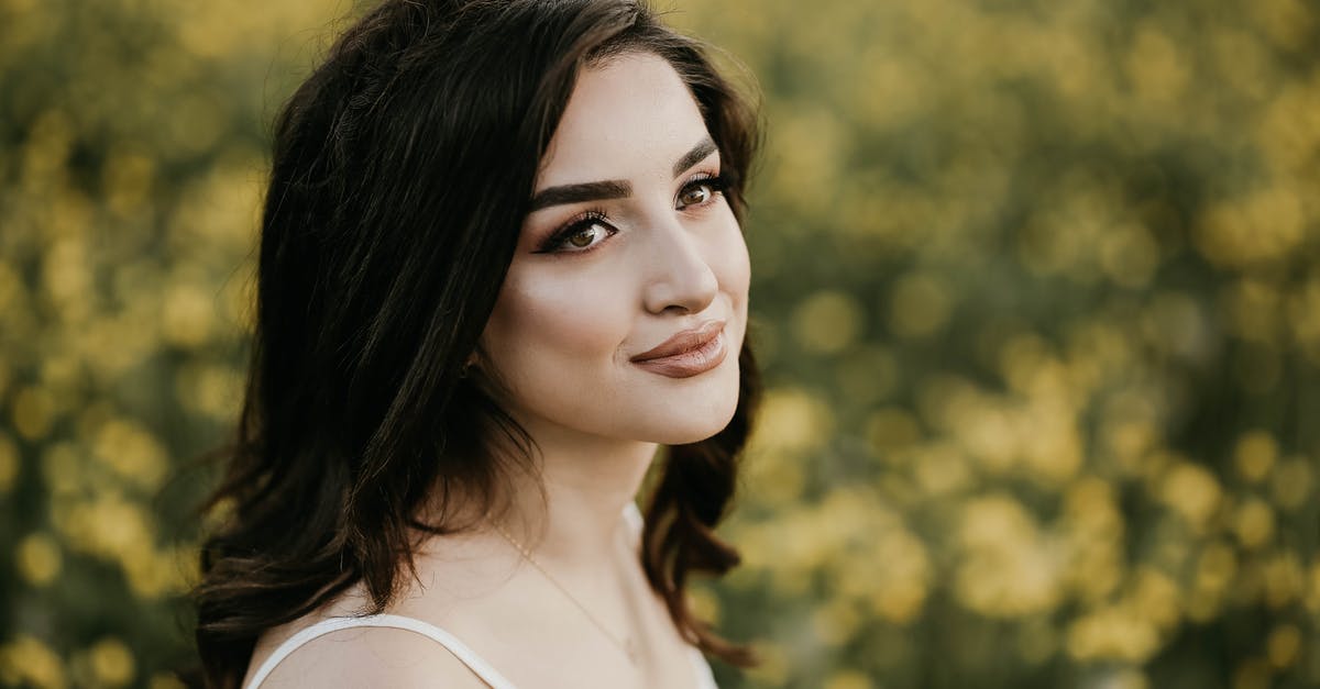 Why do "saute pans" have straight sides? - Attractive Brunette Woman in Meadow of Yellow Flowers