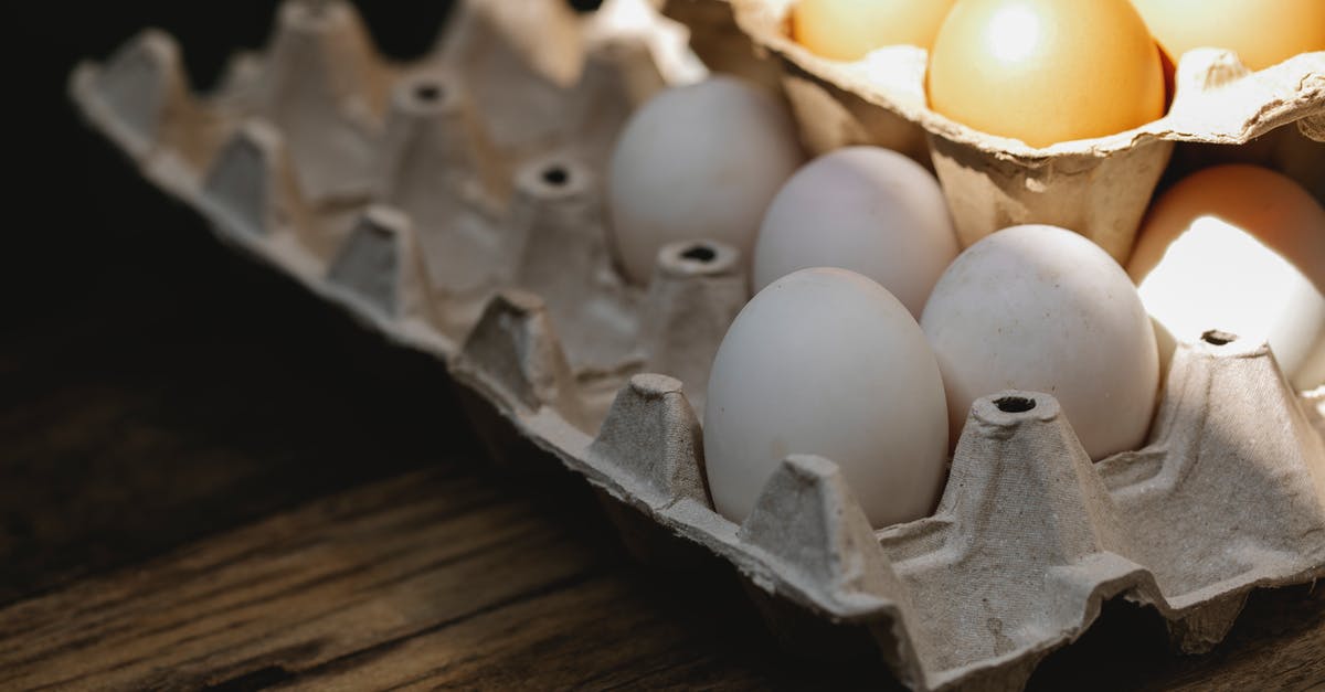 Why do stuffed shells recipes include eggs? - Carton box with fresh eggs placed on wooden surface