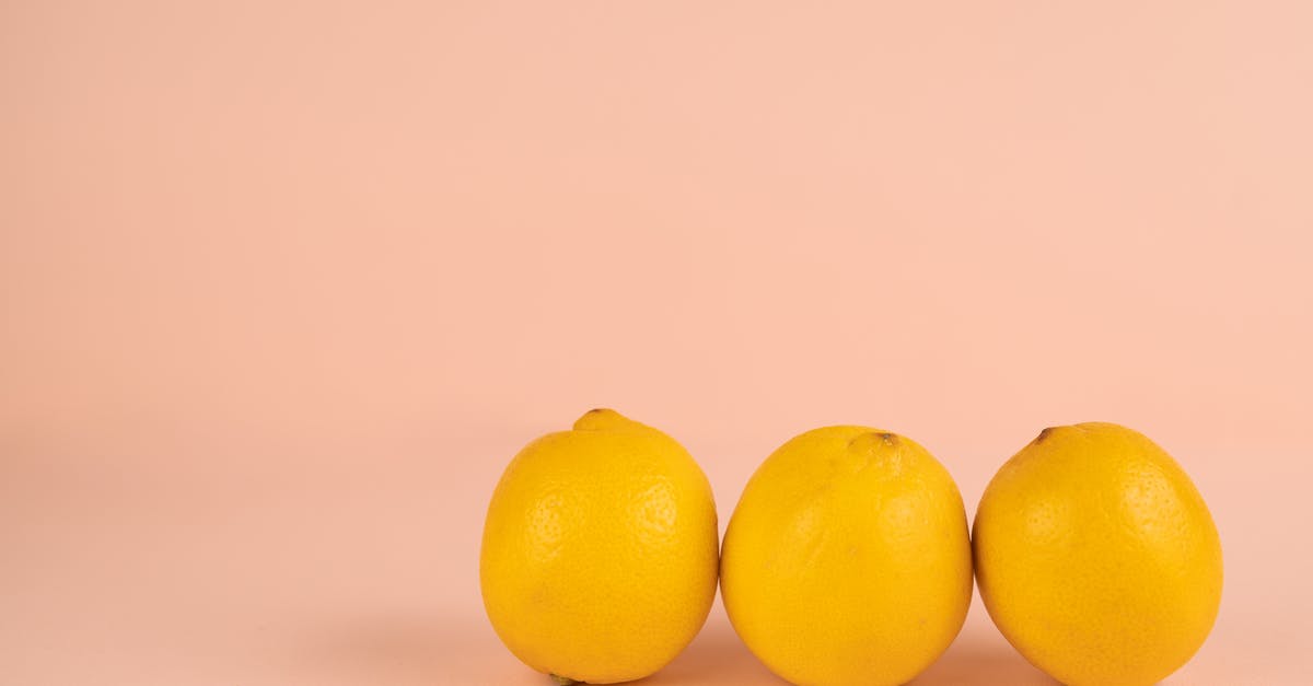 Why do we peel carrots? - Fresh lemons in row on pastel background