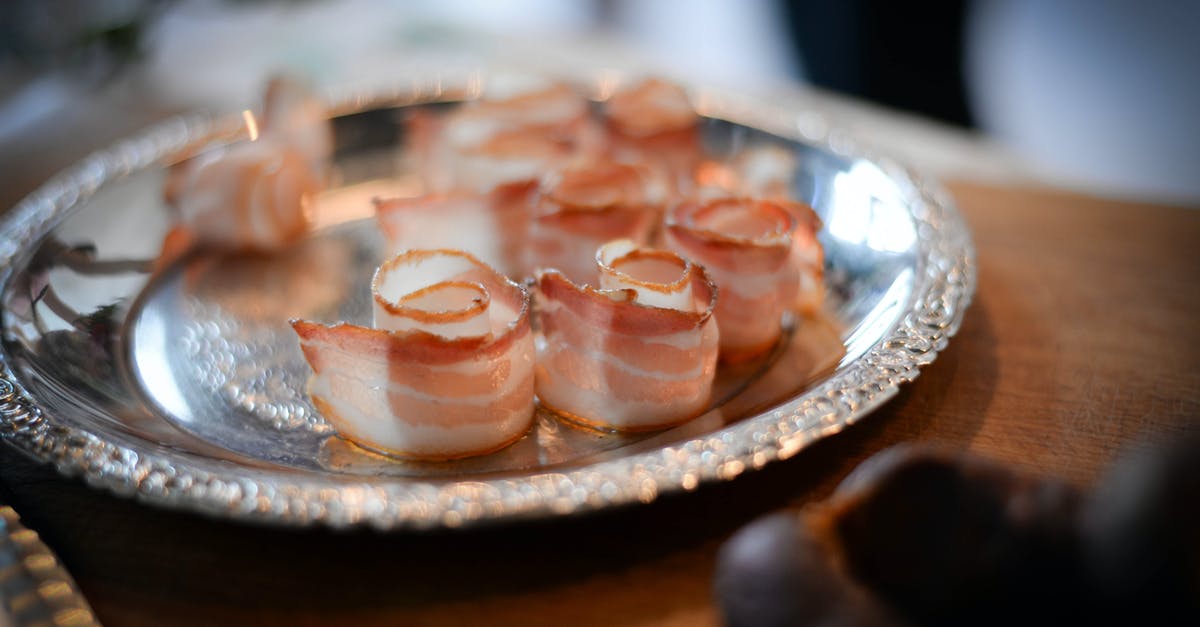 Why do we slice some meats thinly and not others? - Plate with bacon on banquet table