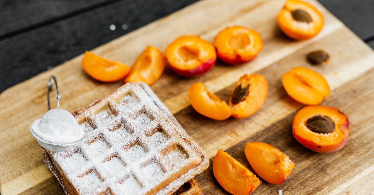 Why do you use sugar when canning peaches or pears? - Sliced Orange Fruits on Brown Wooden Chopping Board