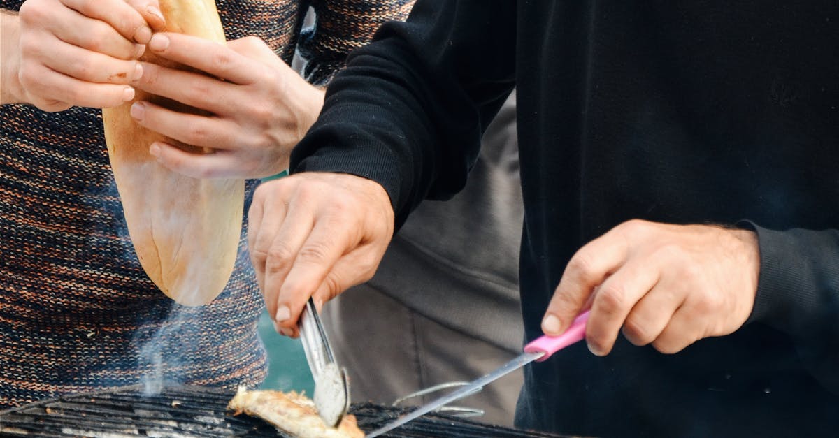 Why does bread soften after heating it up? - Person Grilling Outdoors