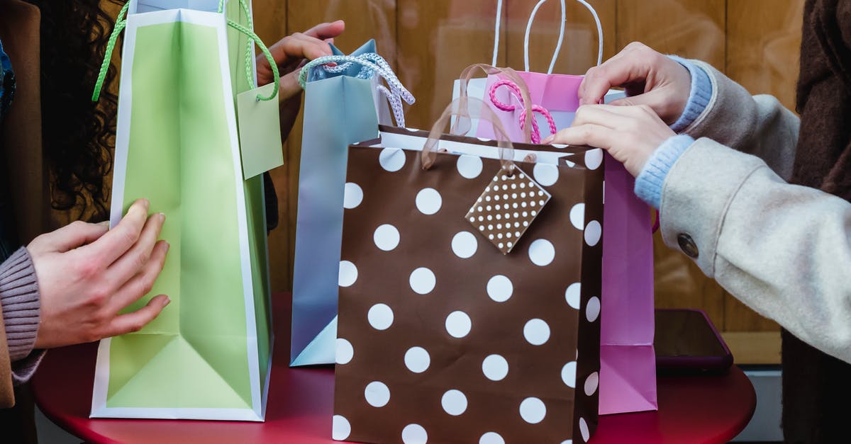 Why does broiled and roasted salmon give these different results? - Side view of crop anonymous female friends sitting at table with various colorful gift bags bought for occasion