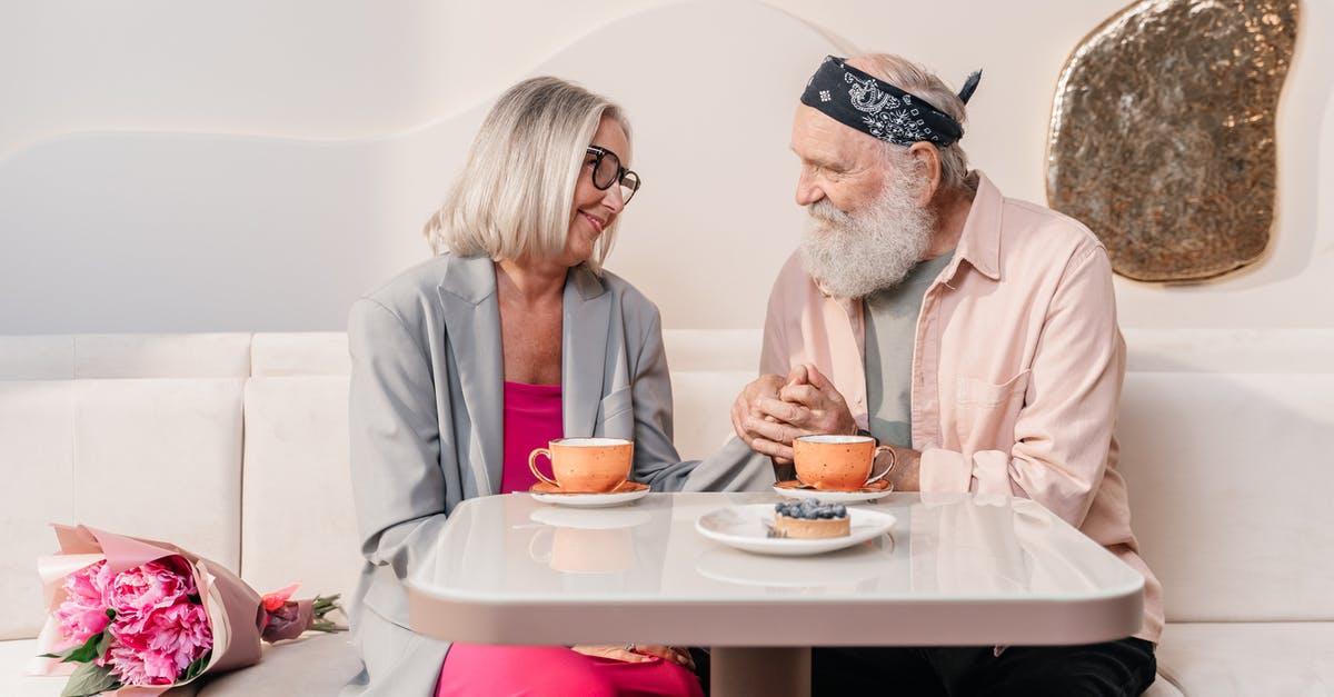 Why does cheese have an expiry date? - Man and Woman Sitting on Chair in Front of Table