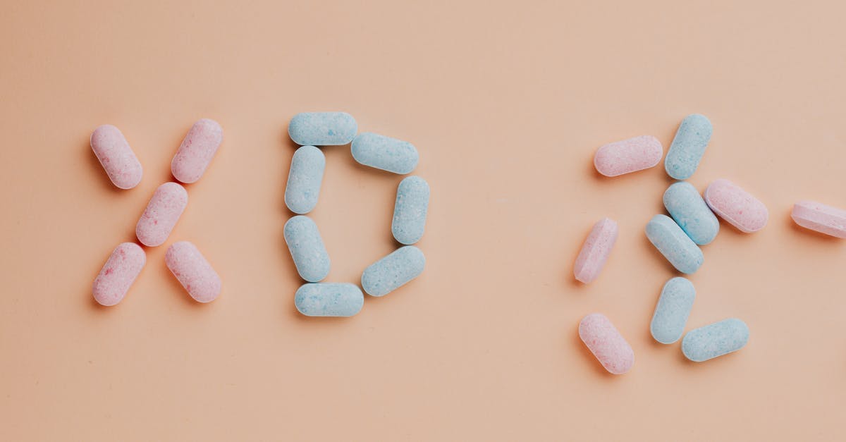 Why does food spoil in the freezer? - Top view composition of yummy pink and blue candy dots placed on pink background