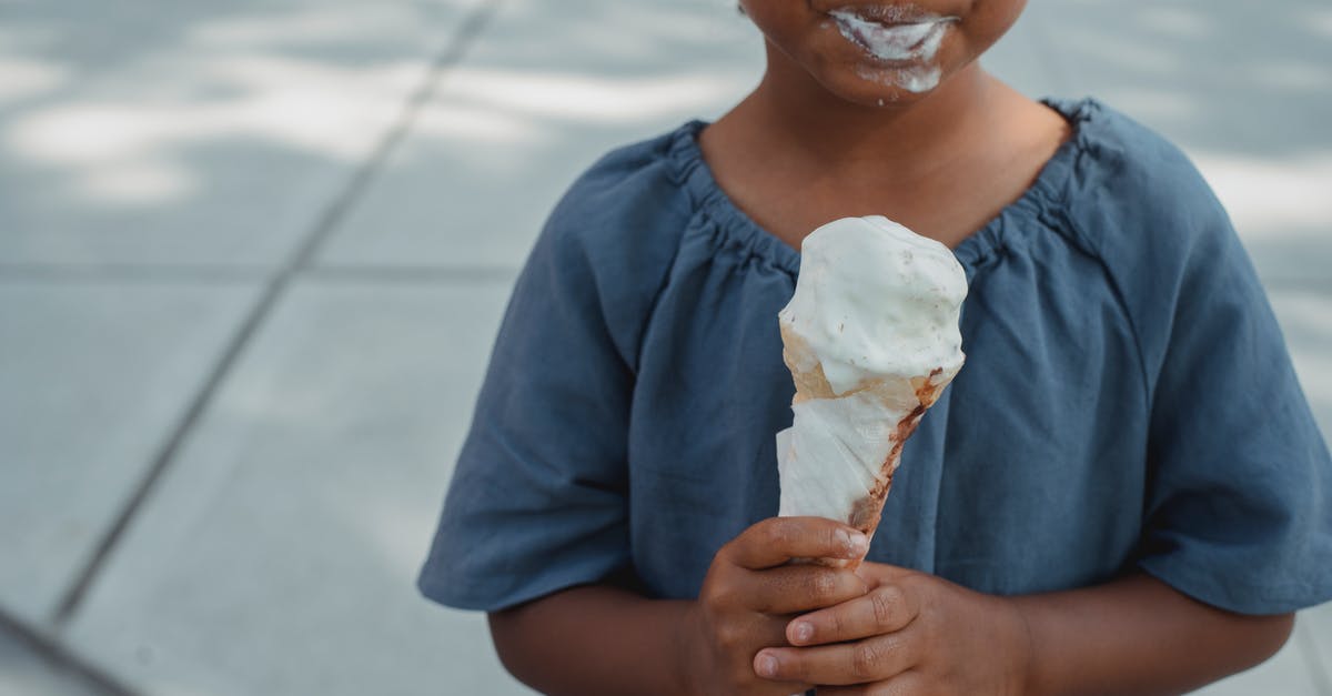 Why does gelling sugar lose its gelling property after some time? - Little child with dirty mouth standing with ice cream on street