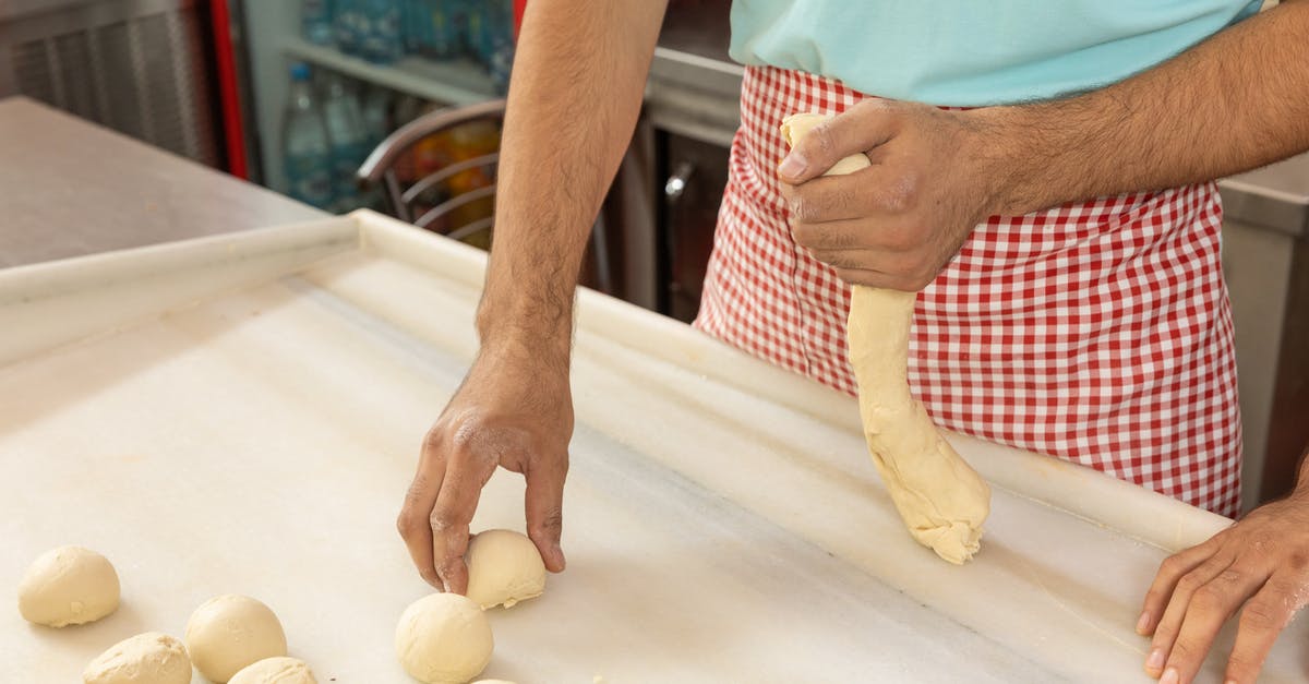 Why does my dough never "fall" after its first rise? - Person Holding Brown Round Bread