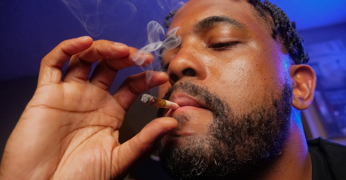 Why does pâte à choux puff up? - Close-Up Photo of Man Smoking Cigarette in Blue Room