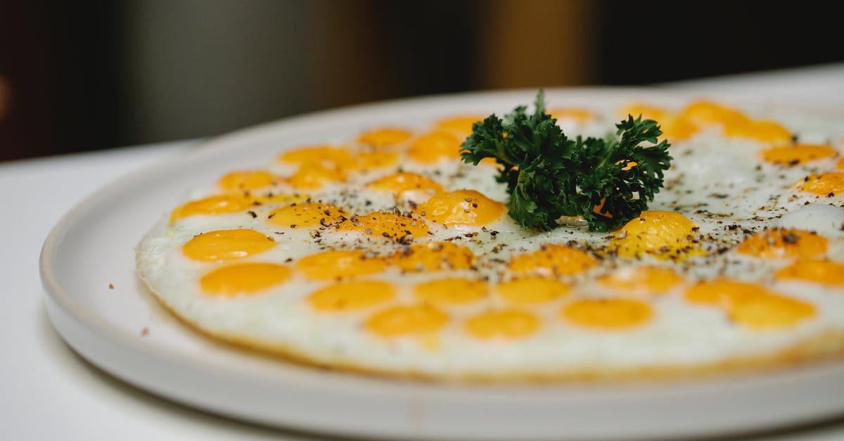 Why does this Egg McMuffins recipe taste terrible? - Delicious yummy fried quail eggs garnished with herbs and served on plate in light room