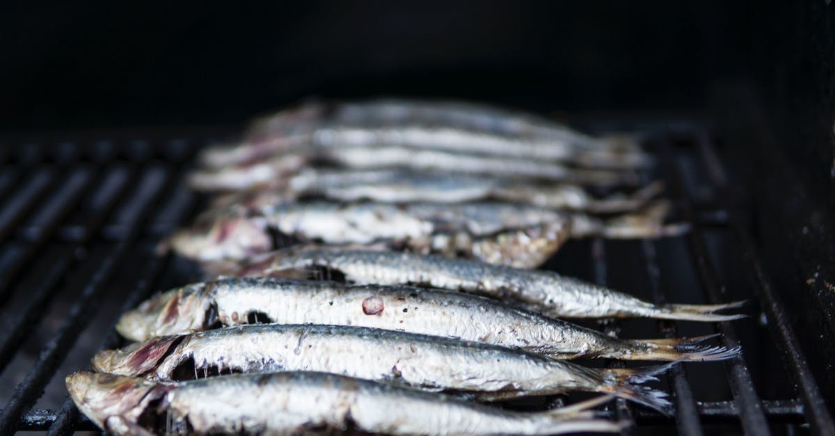 Why does vacuum-sealed fish caution against thawing in the package, but vacuum-sealed meat doesn't? - Photo of Raw Fish on Grill