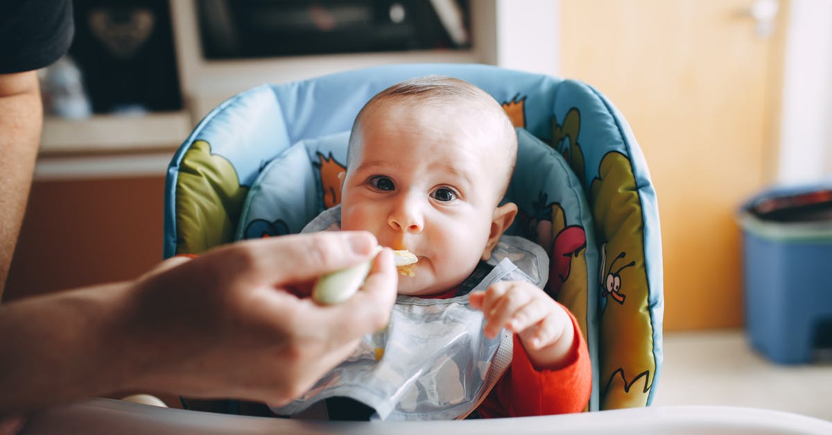 Why don't I have to refrigerate store-bought baby food but have to refrigerate home-made purees? - Little baby eating yummy food from spoon