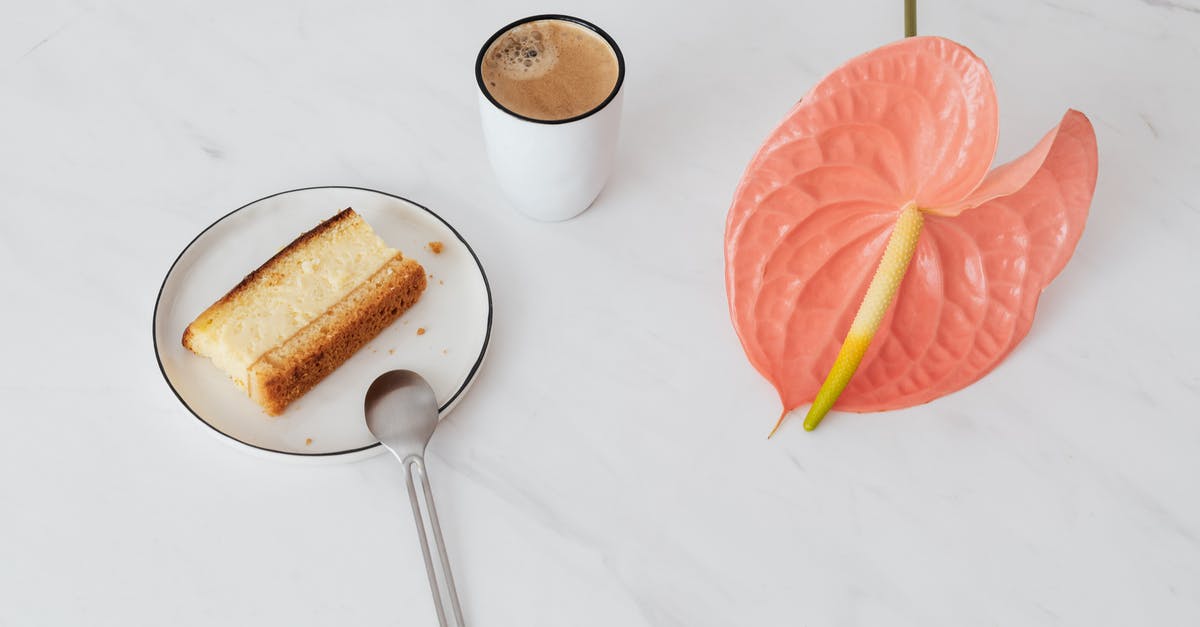 Why don't the single serve coffee cream cups need to be refrigerated? - From above of pink Anthurium placed near ceramic cup of coffee and fresh sweet dessert on ceramic plate with spoon on marble surface Why don't the single serve coffee cream cups need to be refrigerated? - From above of pink Anthurium placed near ceramic cup of coffee and fresh sweet dessert on ceramic plate with spoon on marble surface