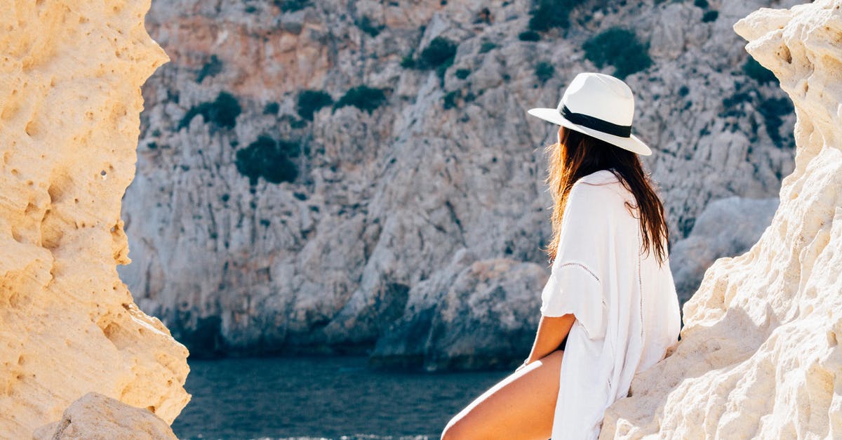 Why exactly is thawing via hot water bad? - Rear View of Woman Sitting on a rock