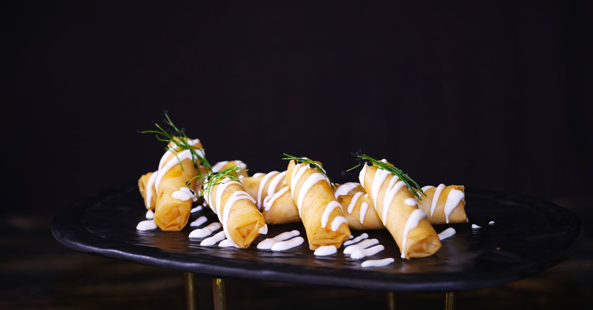 Why fry a teaspoon of dal to start an Indian dish? - Fried Spring Rolls with White Cream and Green Leaves