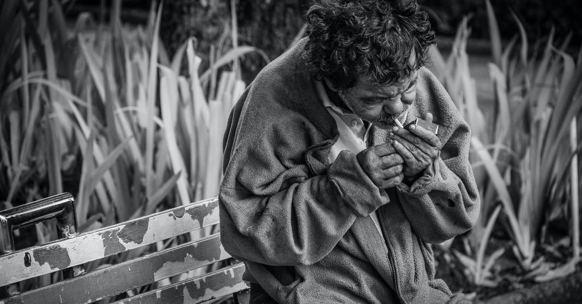 Why has my cold smoking stopped working? - Grayscale Photo of Man With Cigarette Sitting on Bench