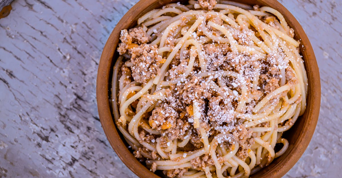 Why is bolognese cooked for so long? - Close-up Photography of Spaghetti