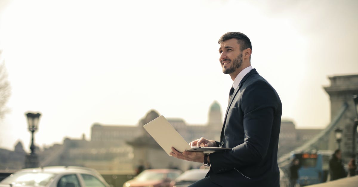 Why is my mac 'n' cheese grainy? - Man Wearing Black Suit While Using Laptop