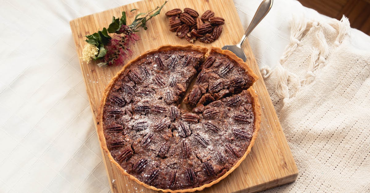 Why is my pecan pie always runny? - A Pecan Pie on Brown Wooden Chopping Board