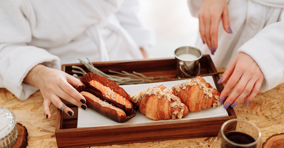 Why is my white bread with poolish dough very loose? - Person Holding Bread on Brown Wooden Tray