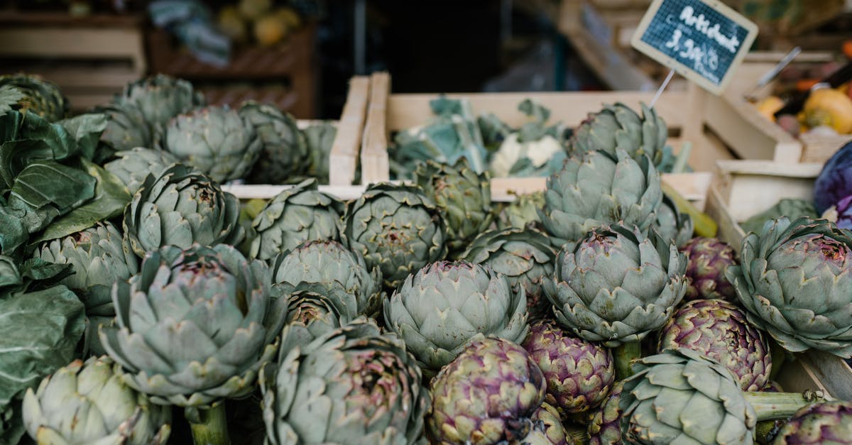 Why is "raw" honey thicker than the one you buy in regular super markets? - Ripe artichokes in boxes in market Why is "raw" honey thicker than the one you buy in regular super markets? - Ripe artichokes in boxes in market